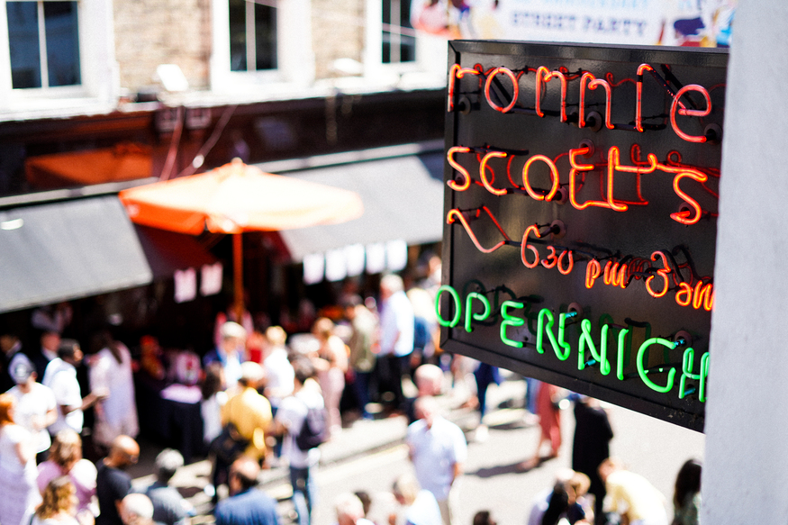 A Ronnie Scott's sign above the street
