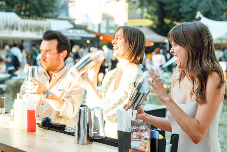 Things to do in London this weekend:  three people shaking cocktails at a bar