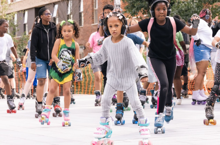 This weekend in London:  children and adults wearing headphones while roller skating
