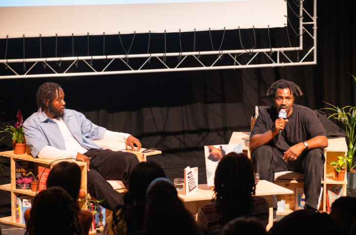 Things to do in London this weekend: two people sitting in chairs on stage taking part in a panel discussion