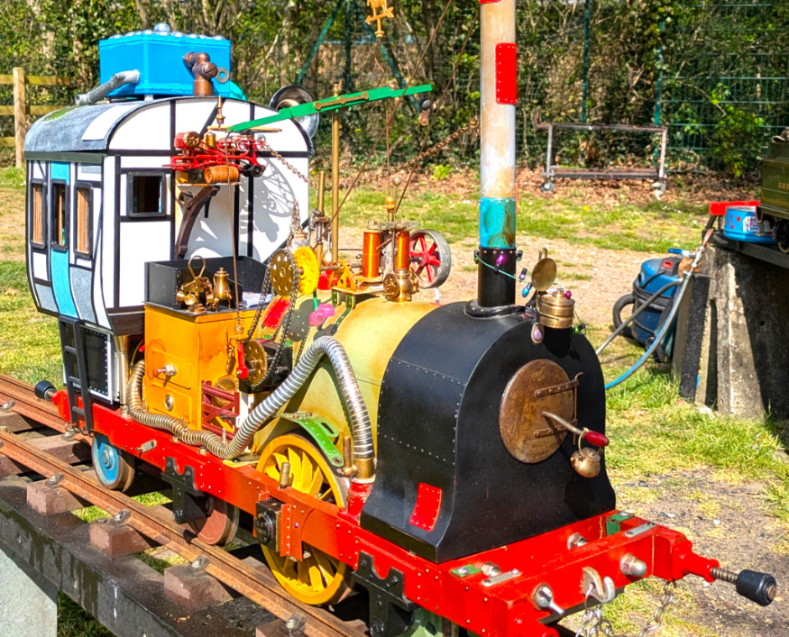 This weekend in London: a miniature train engine with many gadgets and gizmos attached
