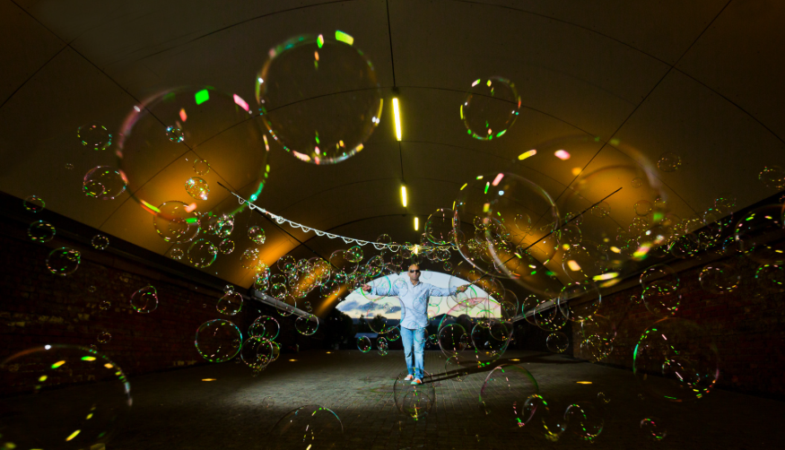 Things to do today in London: a man surrounded by dozens of bubbles