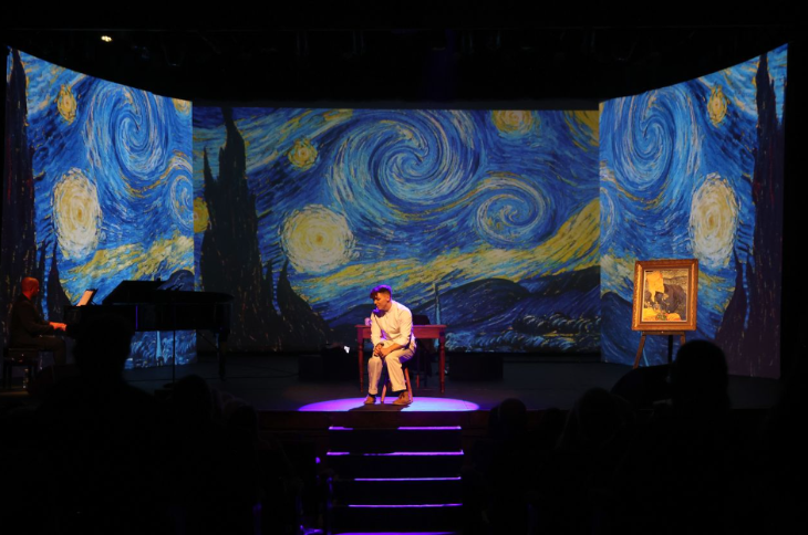 Things to do in London this weekend: a man on stage, surrounded by projections of Van Gogh's Starry Night