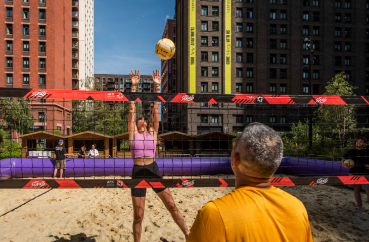 Things to do in London this weekend: people playing beach volleyball on a sand court
