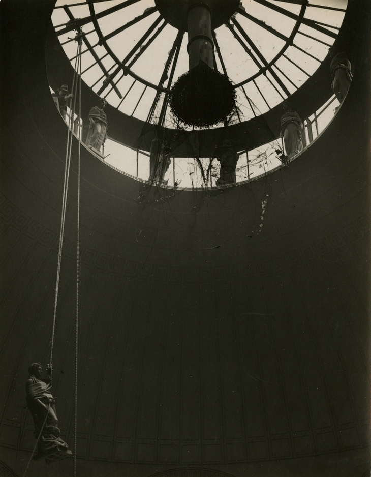Caryatids being lowered from lantern window during demolition work. Photographed by Humphry & Vera Joel, 1920s.