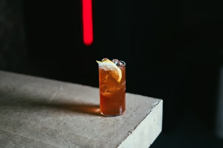 A cocktail on a granite bar