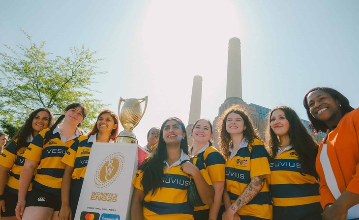 Female rugby players in front of Battersea Power Station