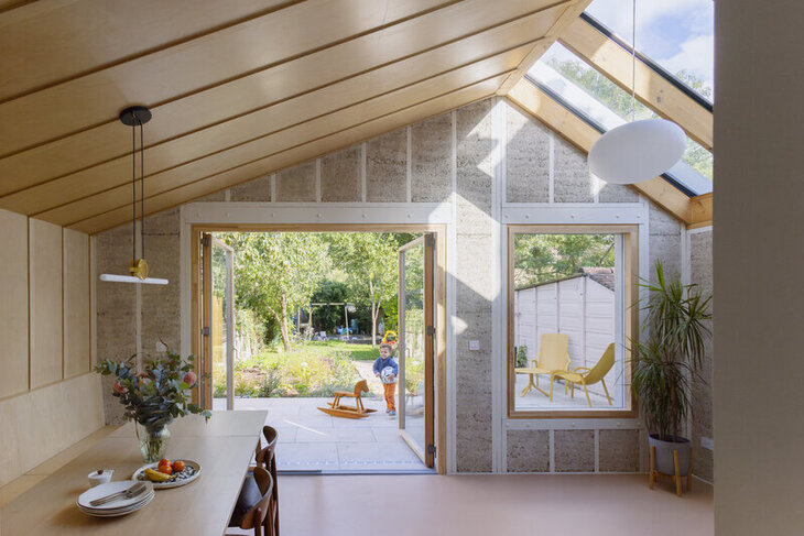 A house with bifold windows leading to a garden