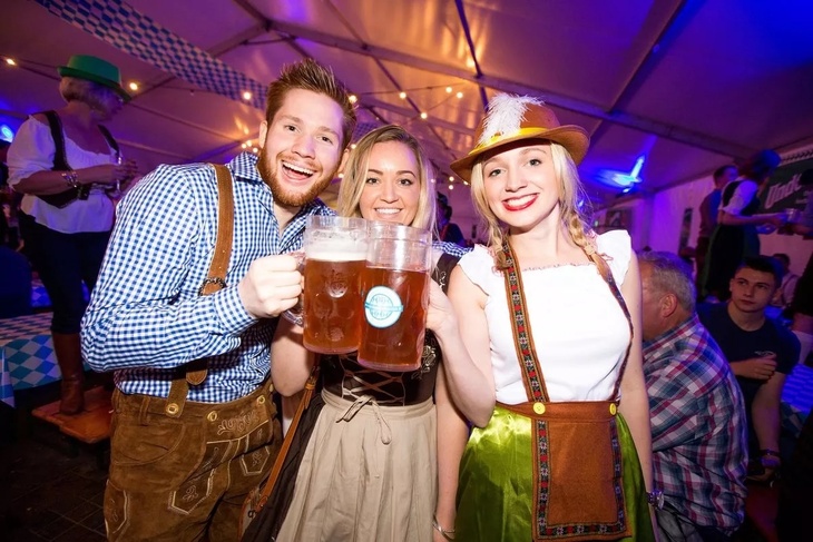 People cheersing at London Oktoberfest