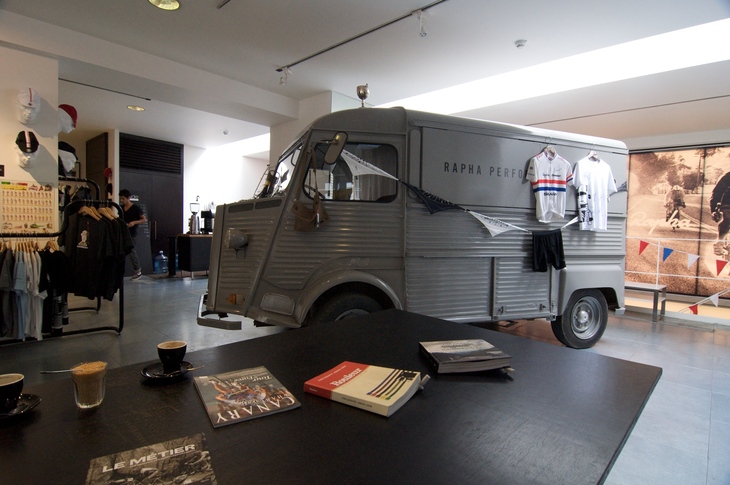 A cafe with a vintage Citroen van parked up inside it