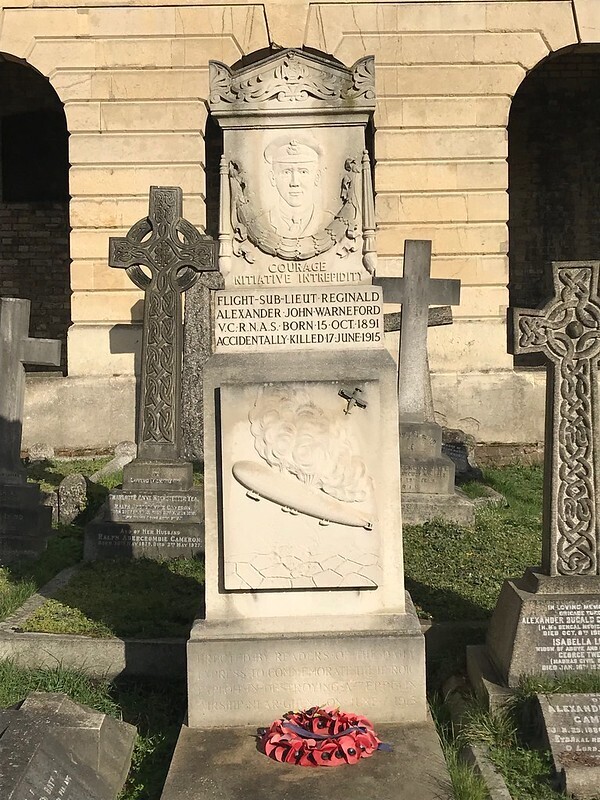 A gravestone showing a deflating Zeppelin