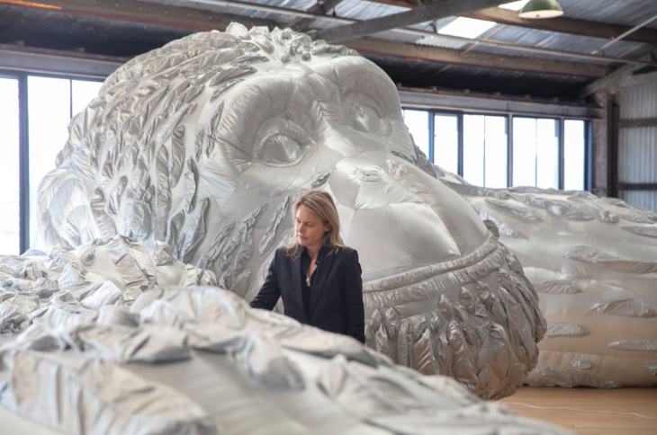 Free things to do in London: a woman working on a very large sculpture of an ape