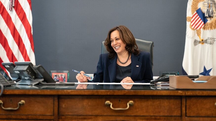Kamala Harris at her desk on the phone