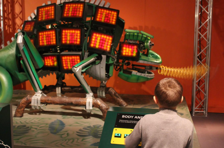 October half term 2025 events London: a child watching a robotic chameleon