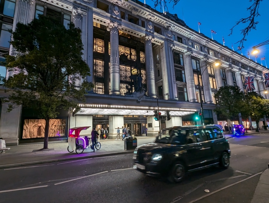 A taxi driving past Selfridges