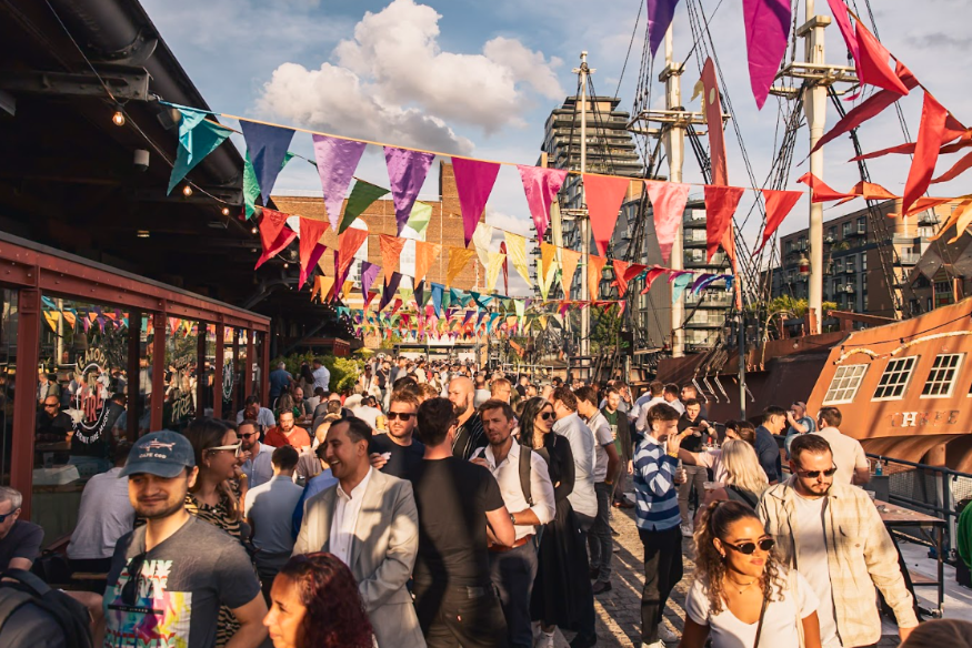 What's on in London this weekend: people at a festival beneath colourful bunting