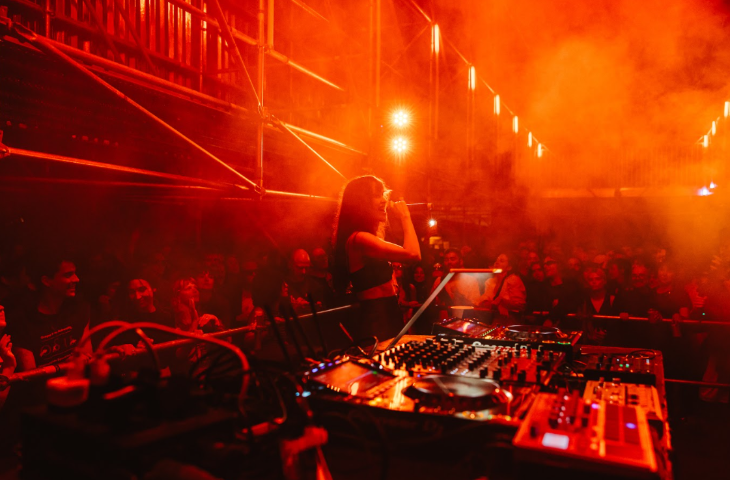 Things to do in London today:  A DJ behind her decks, DJing for a crowd