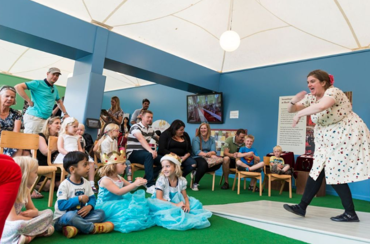 Things to do in London today: a woman performing to a crowd of children and adults