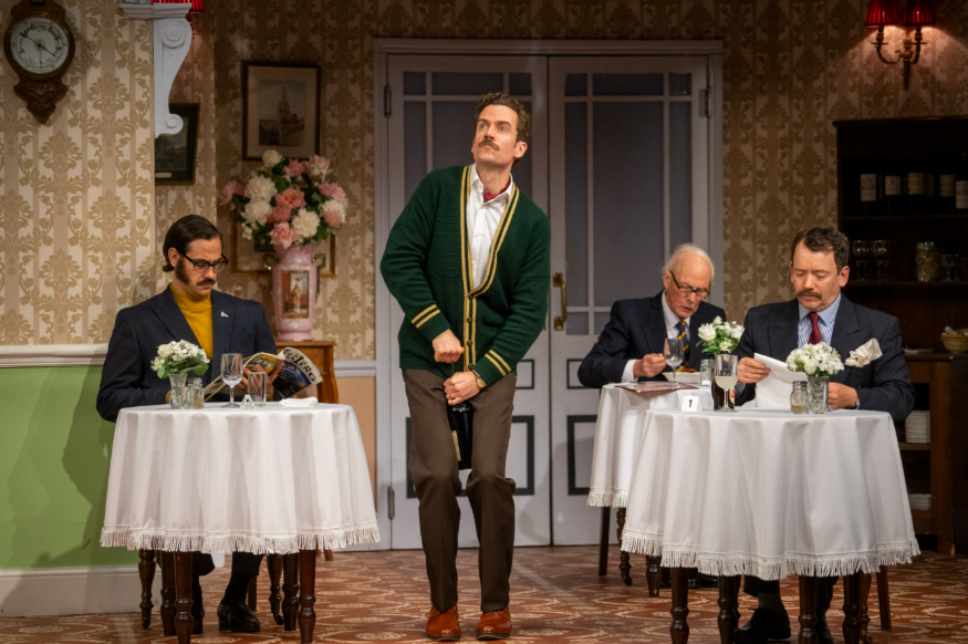 Things to do in London today: Cast members performing in a dining room scene in Fawlty Towers - The Play