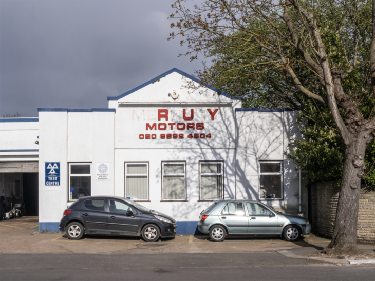 A pitched roof white garage