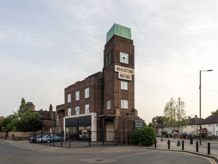 A beautiful deco garage with a clock tower