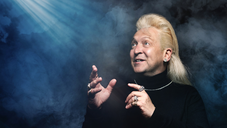 Clinton in a black roll neck