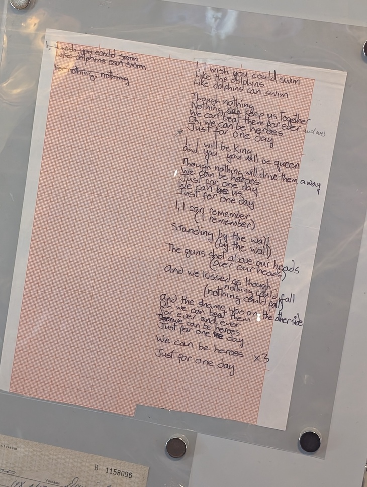 The lyrics to Heroes scribbled on paper