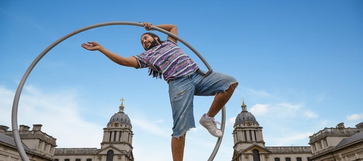 An acrobat with a hula hoop