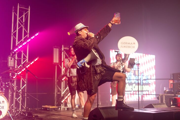 A musician cheersing on stage