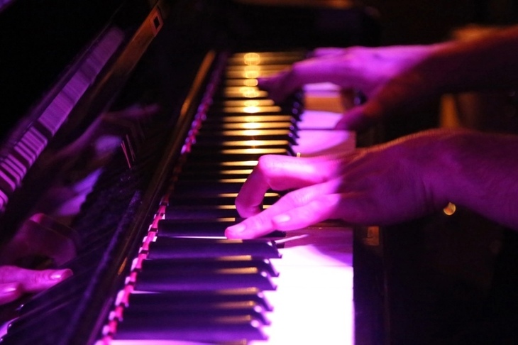 Fingers on a piano