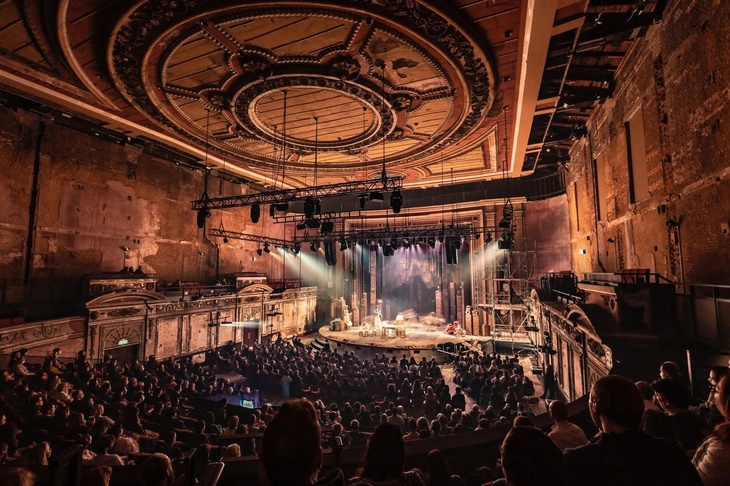 The play being put on in a beautifully distressed theatre