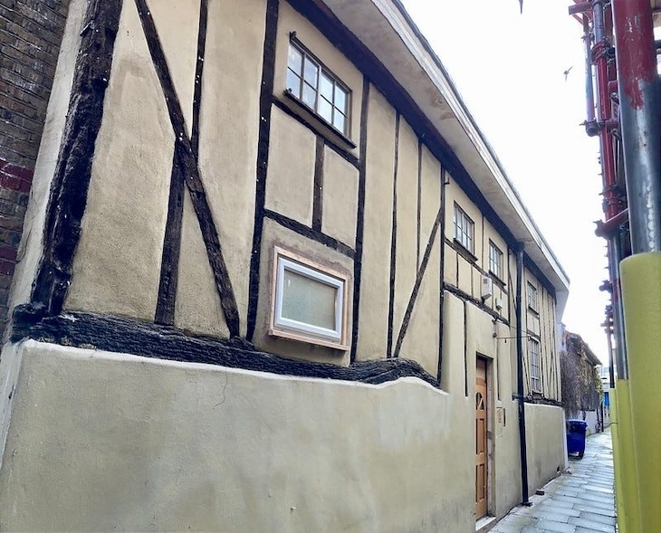 A tudor-style building with a upvc window