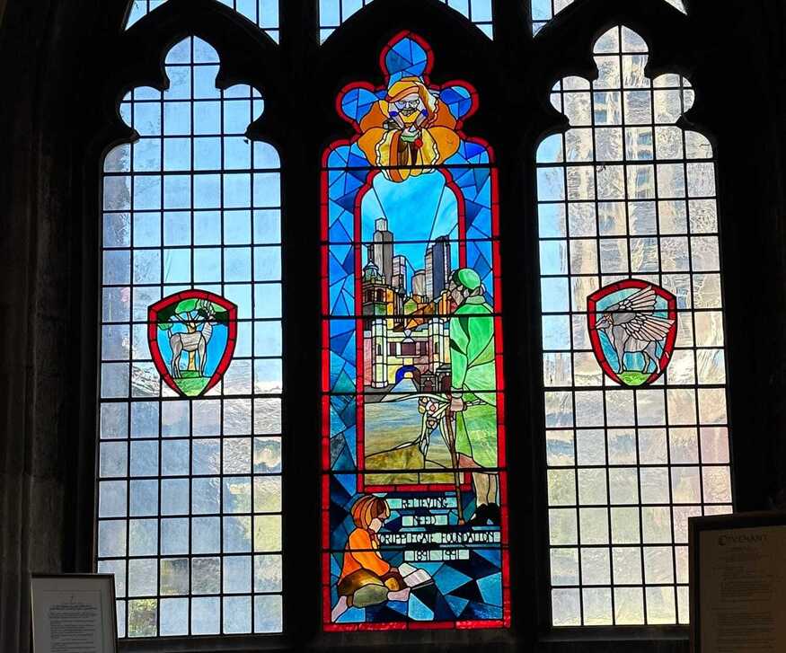 The Cripplegate Window with city buildings 