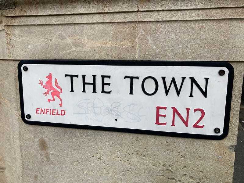 A street sign for The Town in Enfield, EN2