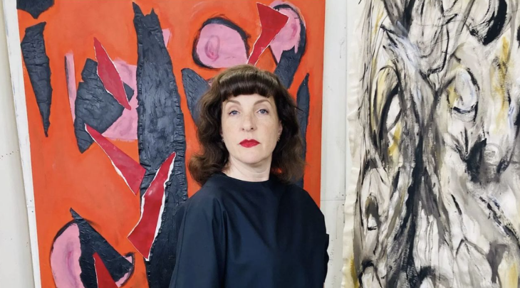 Things to do in London in October 2025: An actor in the role of Lee, standing in front of two paintings