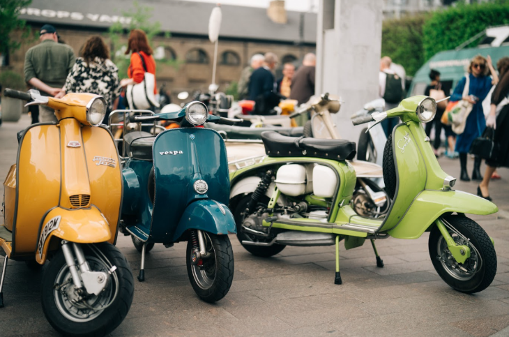 Things to do in London today: three vintage Vespa scooters parked alongside each other