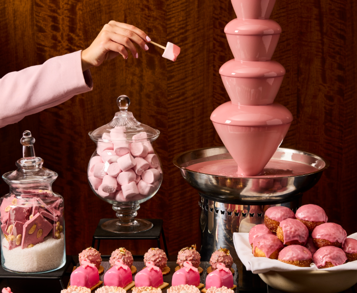 Things to do in London this weekend: a table of pink food including cakes, marshmallows, and a pink chocolate fountain