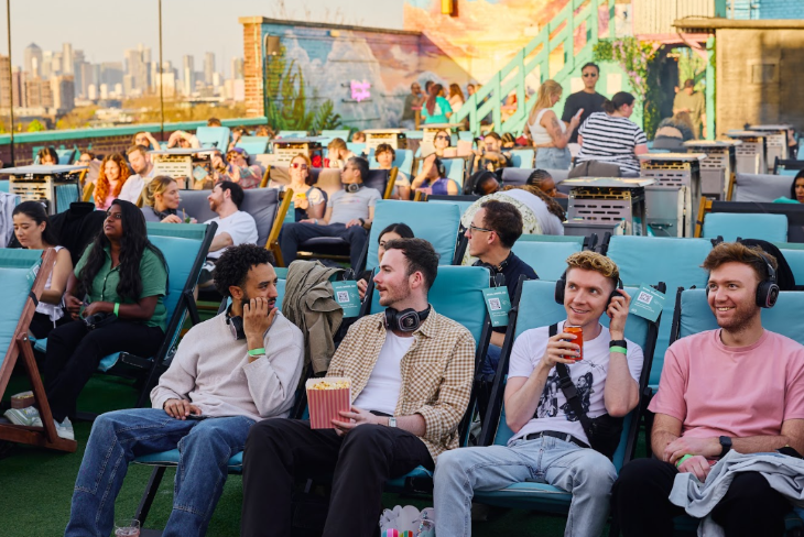 Things to do in London today: people seated in deckchairs at a rooftop cinema