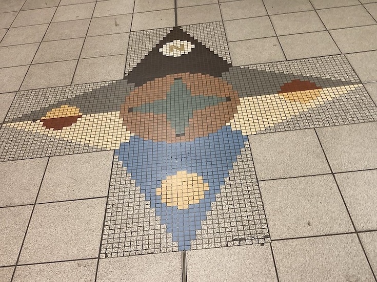 A compass in mosaic form