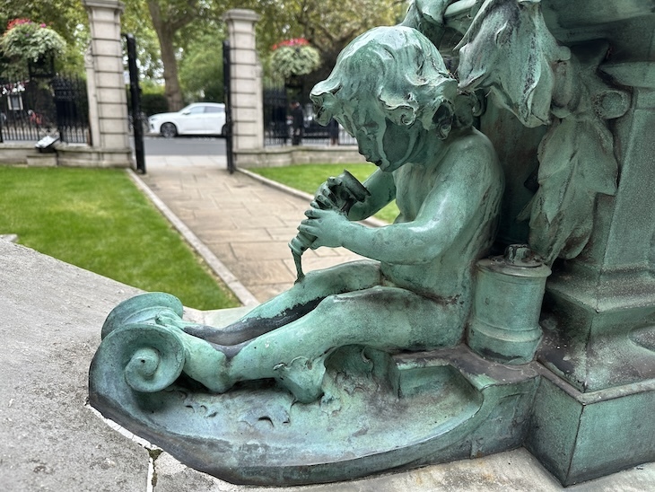 Cherub looking into a telephone