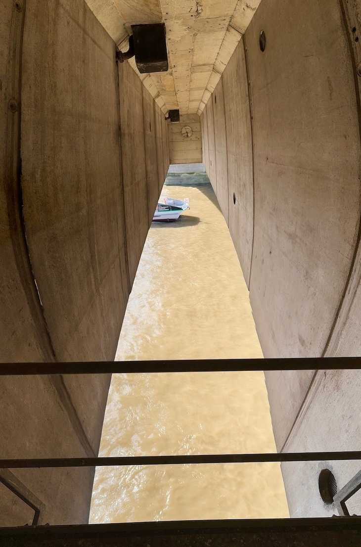 Looking down at the Thames from the underside of London Bridge