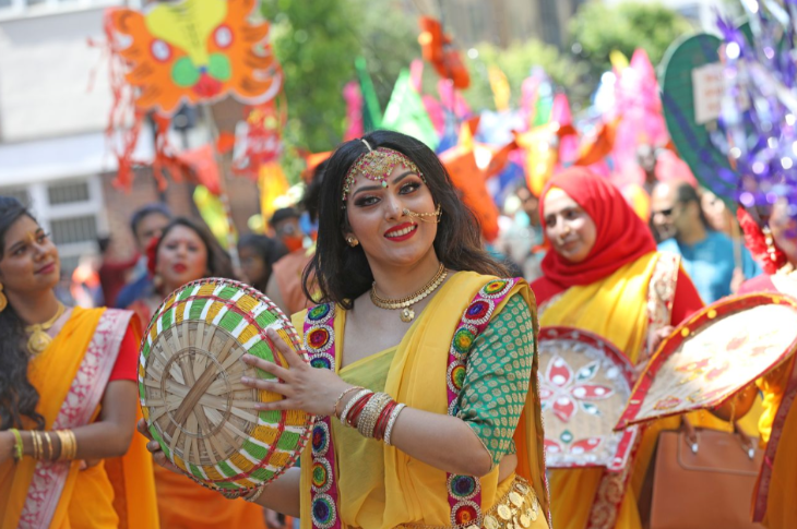 Things to do in London this weekend: a woman in South Asian dress taking part in a performance or parade