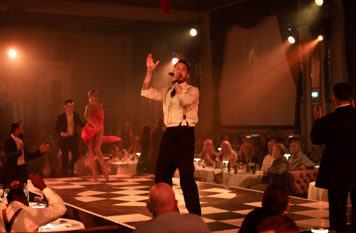 Things to do in London this weekend: a singer performing live on stage with people seated at tables around the stage