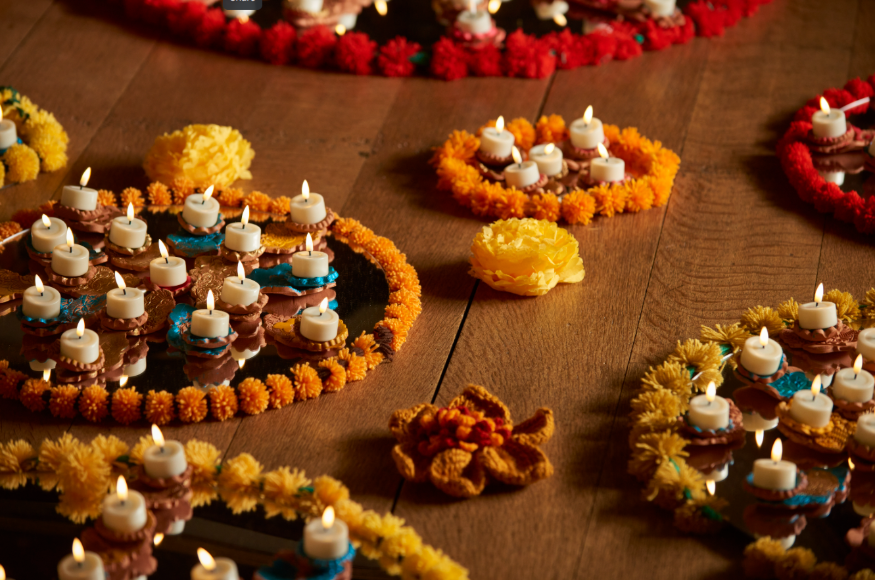 Diwali 2025 in London: a display of candles and floral garlands on a floor