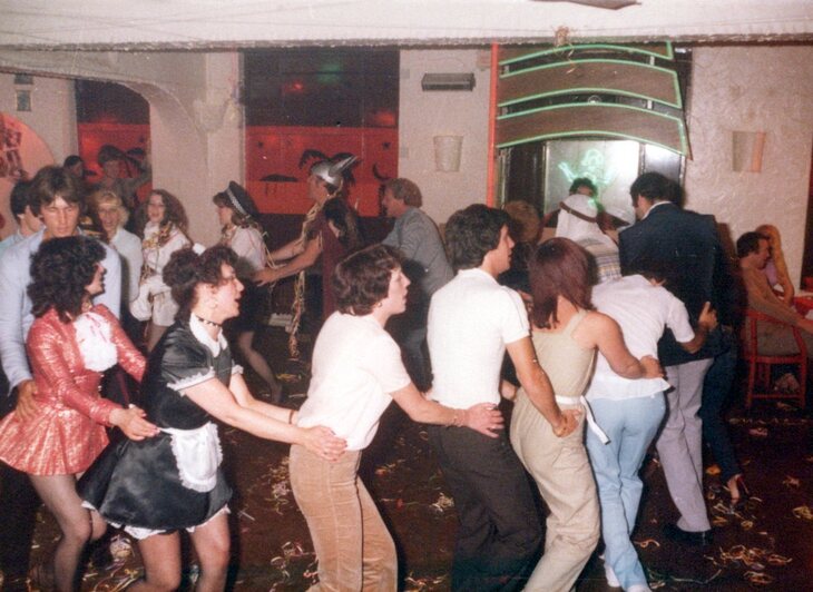 People dancing the conga