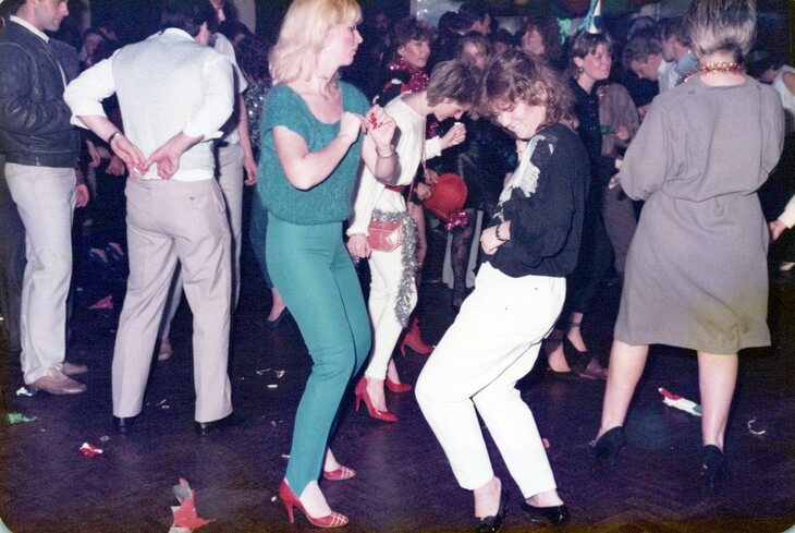 People dancing at a Christmas party, 1980s