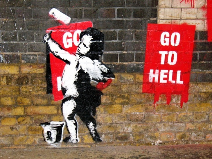 Street art of a fly-posting cherub
