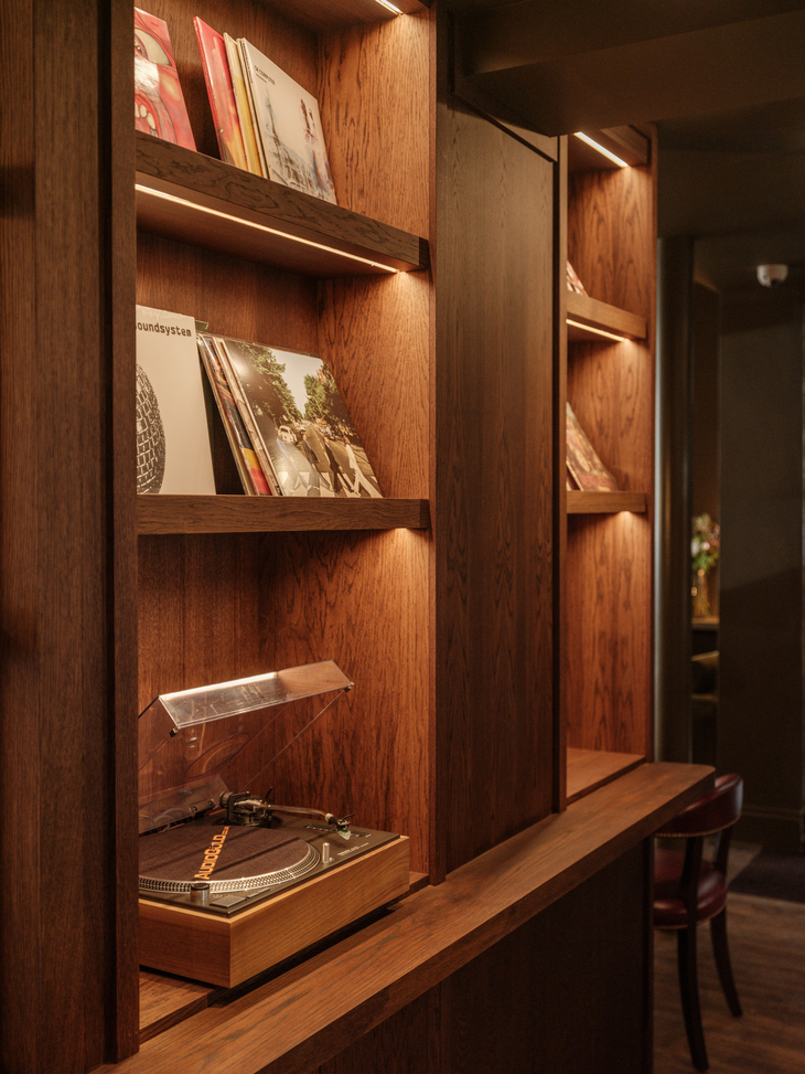 A modernist shelf with load of vinyl records on it