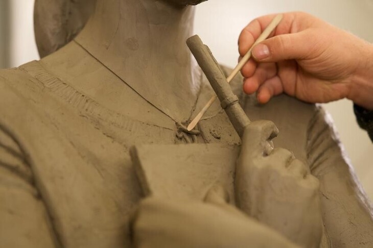 Part of the statue being created
