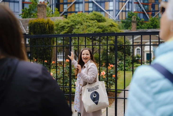 A guide showing people almshouse gardens